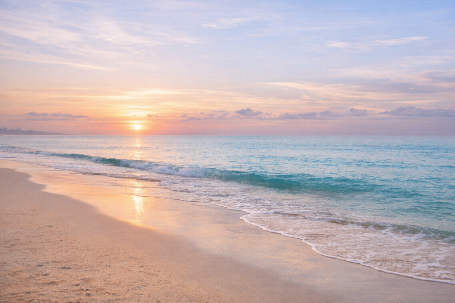 Calm shoreline at early morning with soft pastel sky and gentle waves.